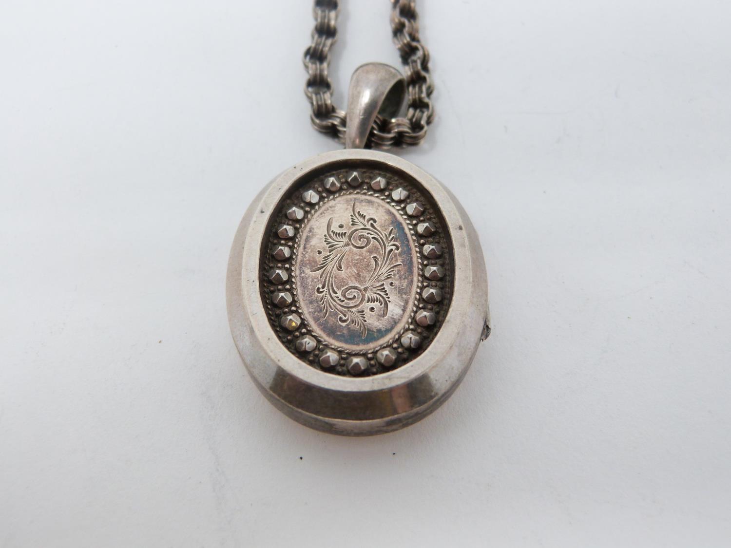 Two Victorian white metal book chains with lockets. One with a wide intricate book chain that - Image 12 of 14