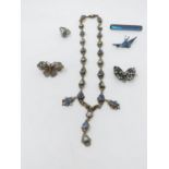A collection of white metal jewellery. Including a blue paste and blister pearl white metal necklace