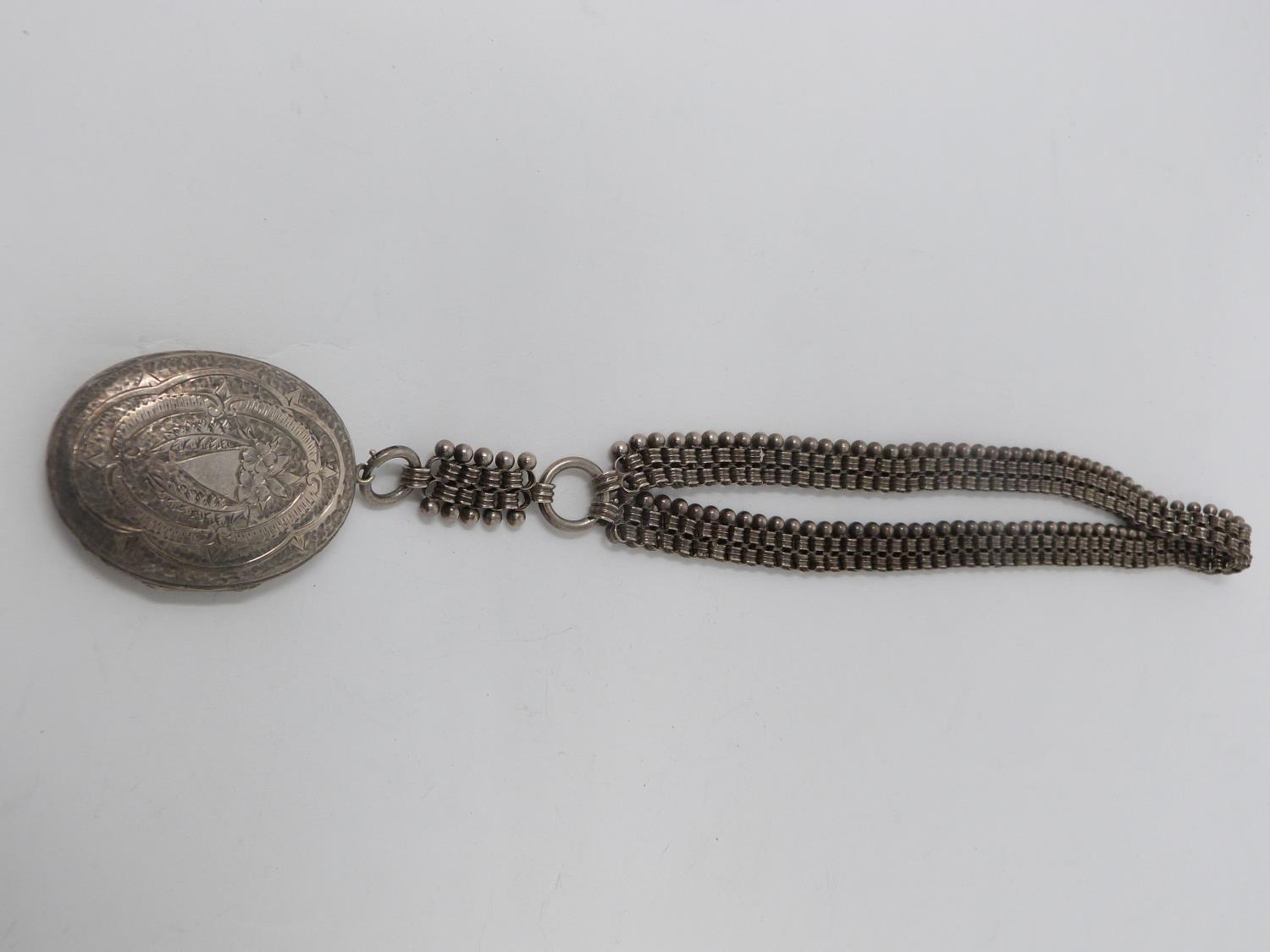 Two Victorian white metal book chains with lockets. One with a wide intricate book chain that - Image 2 of 14