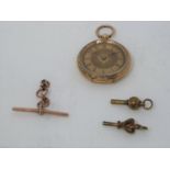 An antique 18 carat yellow gold engraved ladies fob watch and 9ct rose gold T bar, maker JES. Inside