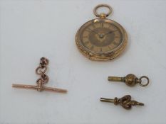 An antique 18 carat yellow gold engraved ladies fob watch and 9ct rose gold T bar, maker JES. Inside