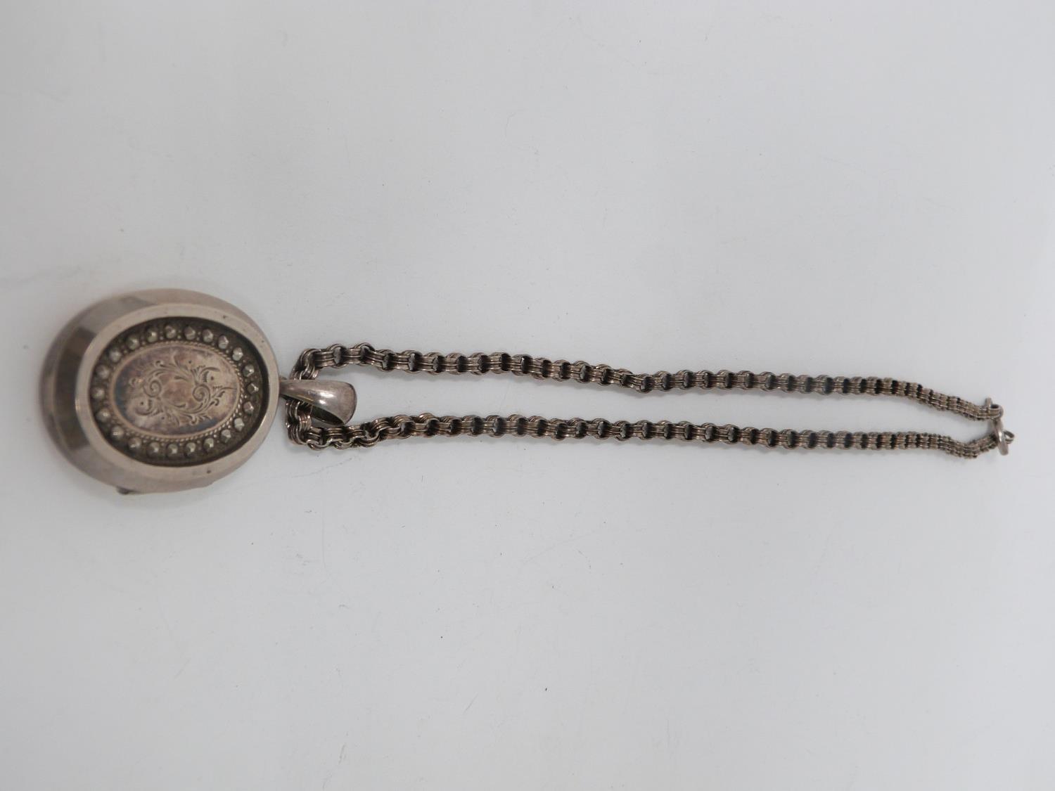 Two Victorian white metal book chains with lockets. One with a wide intricate book chain that - Image 11 of 14