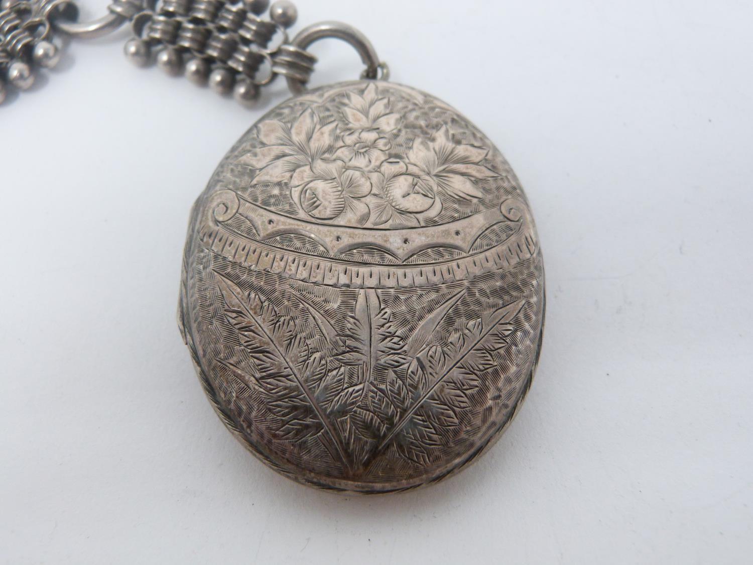 Two Victorian white metal book chains with lockets. One with a wide intricate book chain that - Image 8 of 14