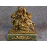 An antique gilded French bronze of a couple, male is wearing a turban and pantaloons, lady is