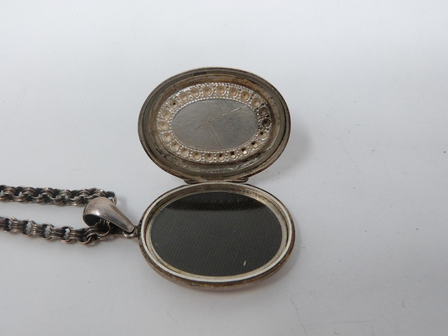 Two Victorian white metal book chains with lockets. One with a wide intricate book chain that - Image 13 of 14