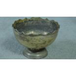 An antique silver pedestal bowl with waved edged, makers mark HE Ltd for Hawksworth, Eyre & Co