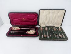 A Victorian cased set of spoons with a cased set of tea spoons and tongs. A pair of silver fruit