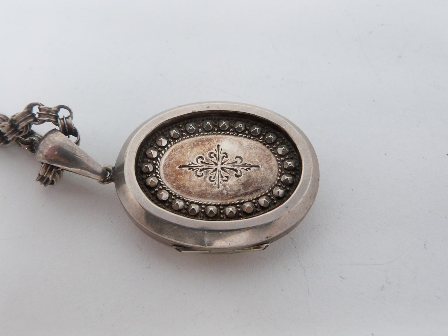 Two Victorian white metal book chains with lockets. One with a wide intricate book chain that - Image 14 of 14