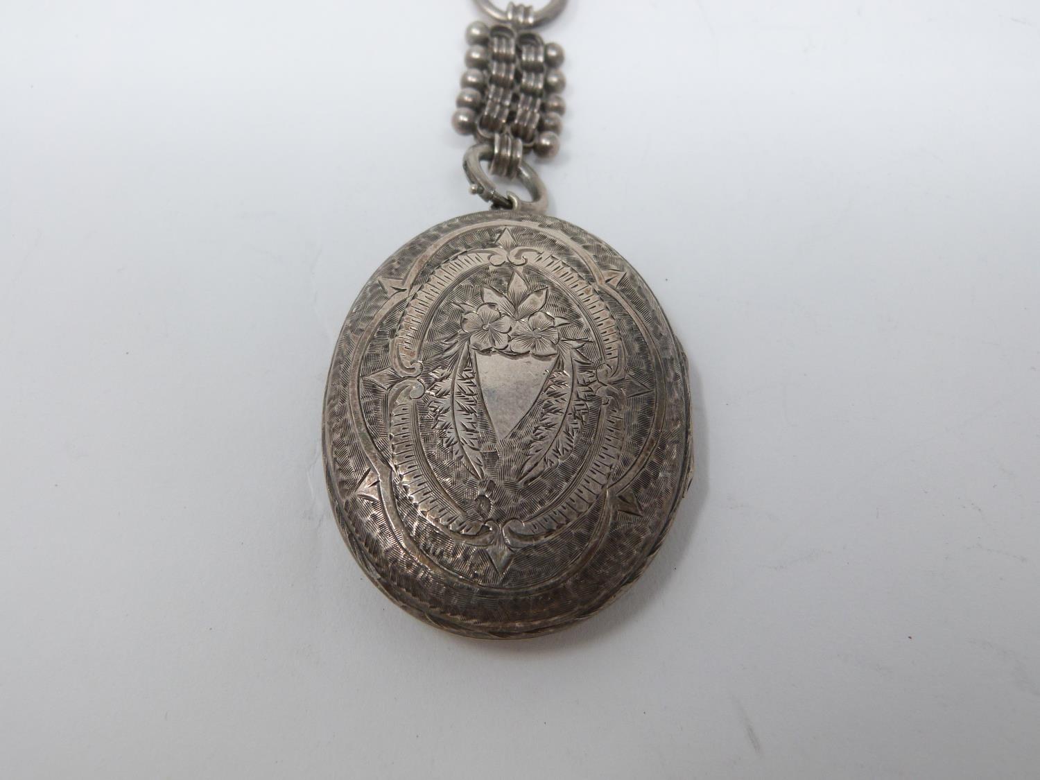 Two Victorian white metal book chains with lockets. One with a wide intricate book chain that - Image 3 of 14