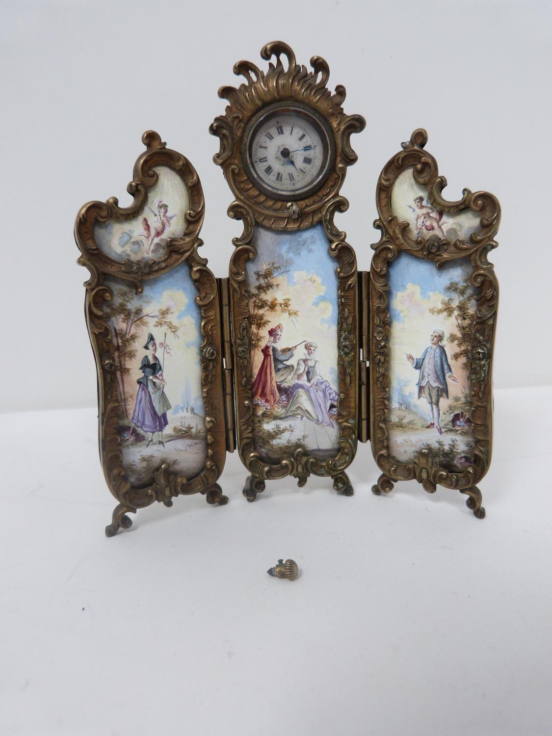 An antique gilt silver Austrian enamel miniature triptych clock. Winder for the hands has come loose