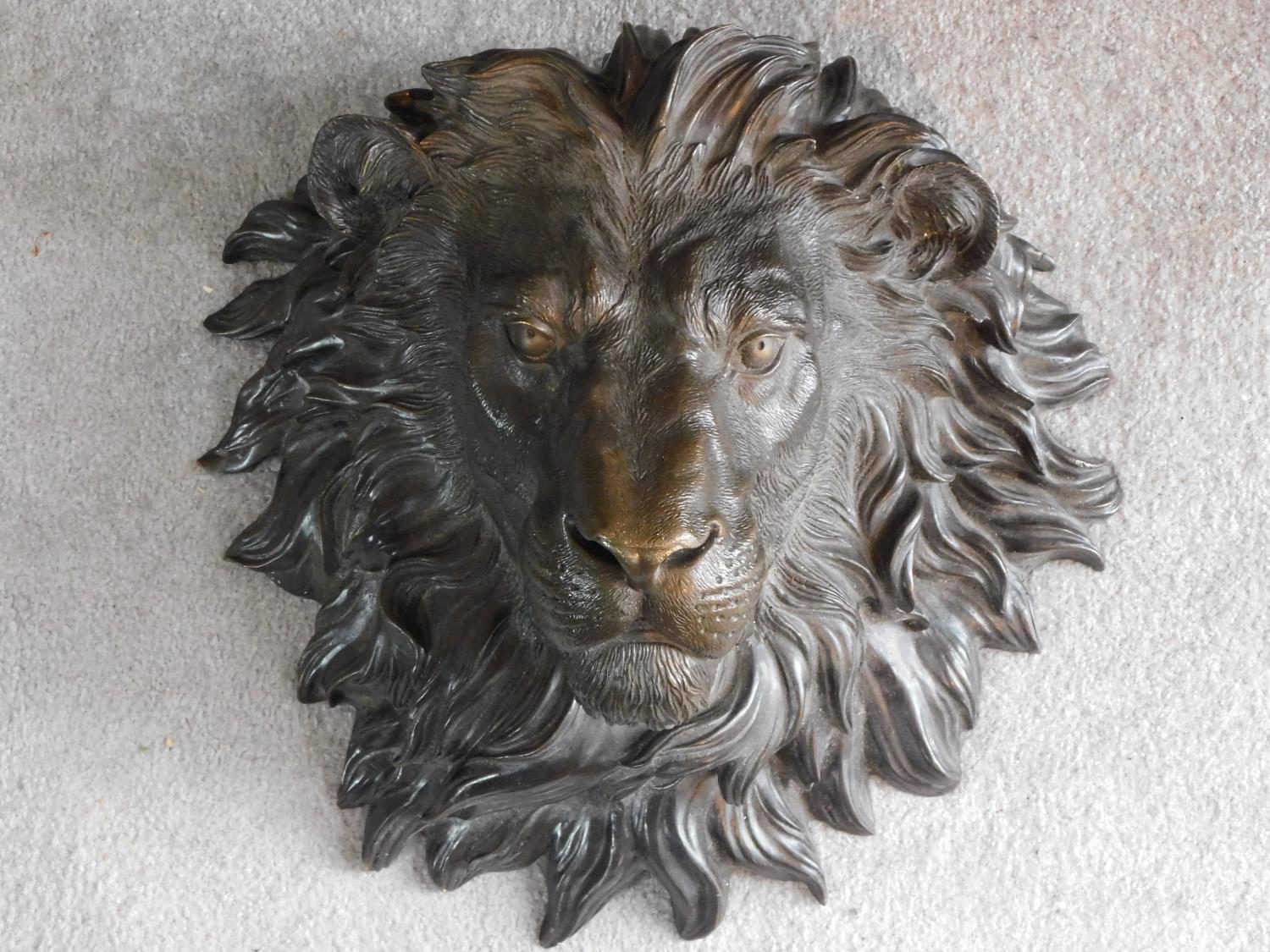 An Italian antique bronze wall mounted lion head. Realistically modelled. 45x46cm