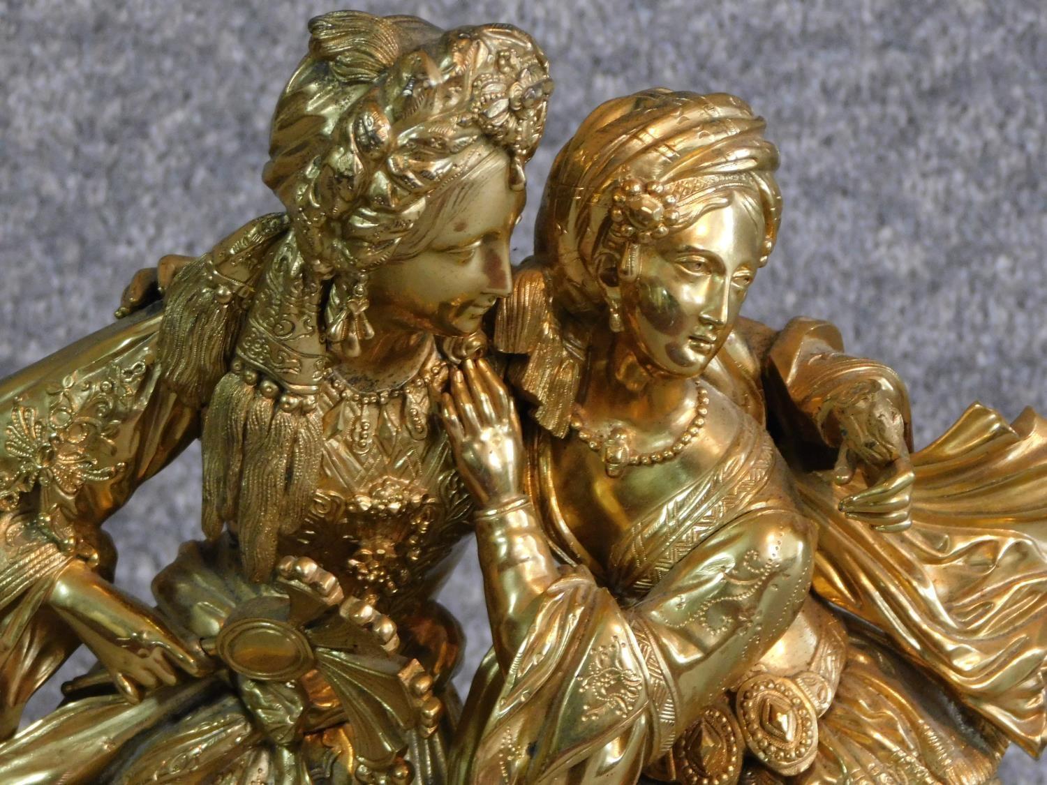 An antique gilded French bronze of a couple, male is wearing a turban and pantaloons, lady is - Image 2 of 4