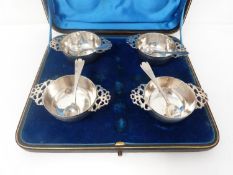 A cased set of Victorian silver salts shaped as quaich's with matching spoons. 1893, London,