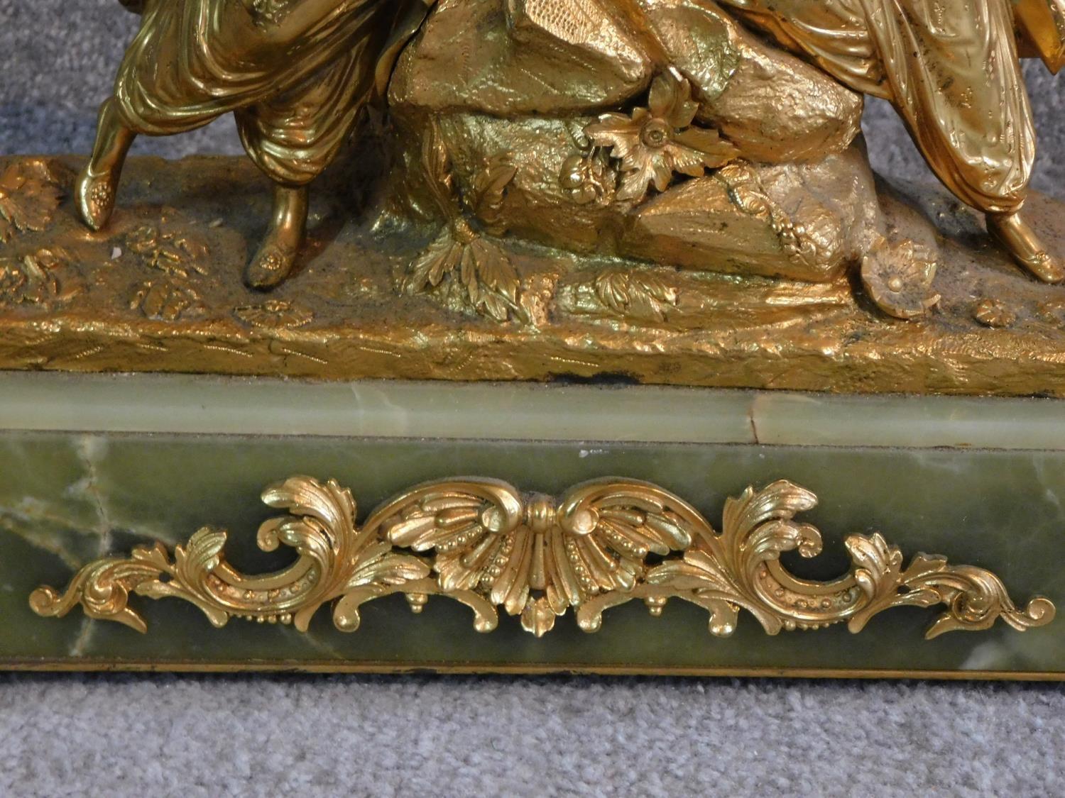 An antique gilded French bronze of a couple, male is wearing a turban and pantaloons, lady is - Image 3 of 4
