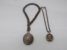 Two Victorian white metal book chains with lockets. One with a wide intricate book chain that