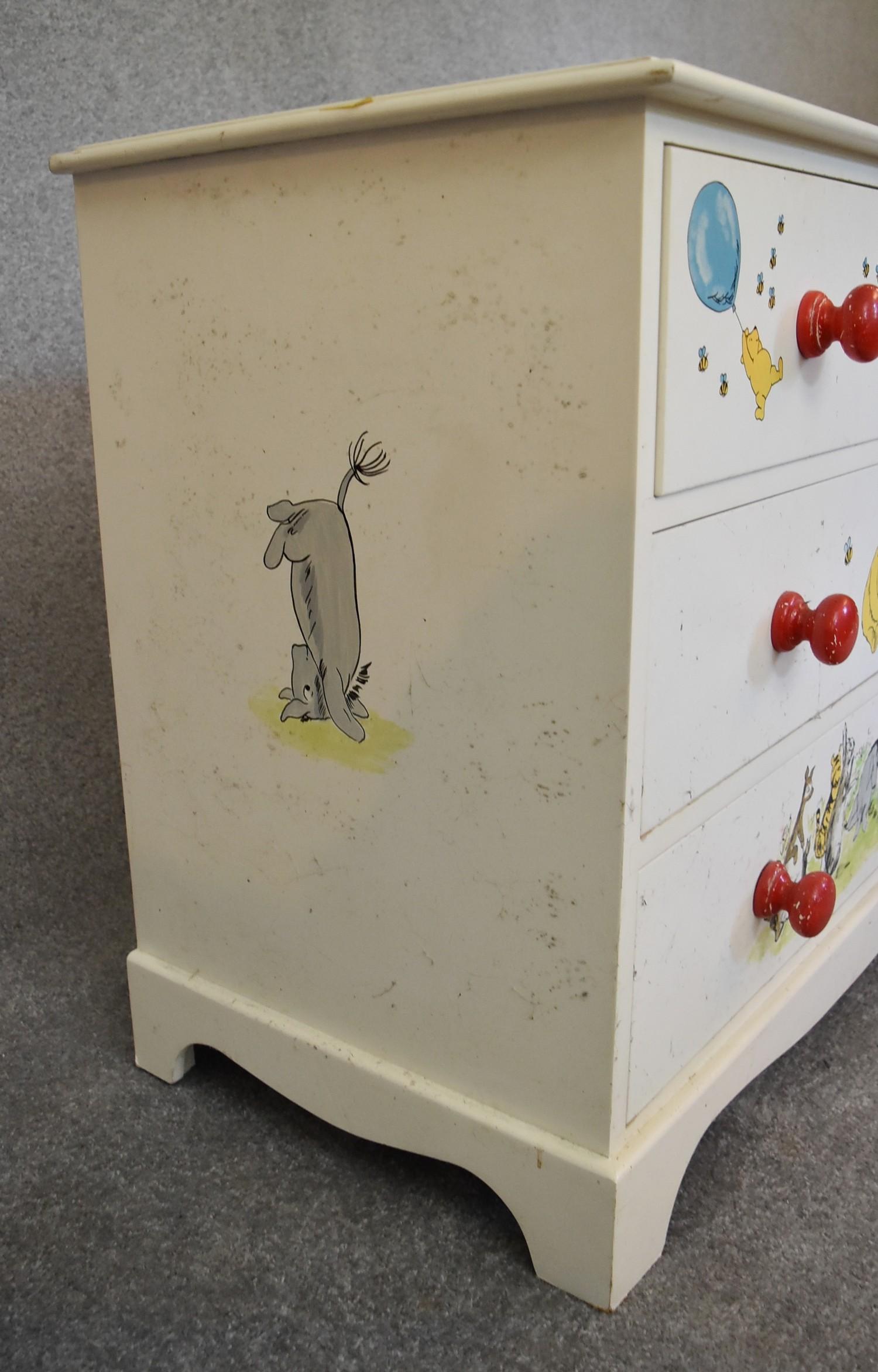 A pair of white painted pine chest of drawers with two short over two long drawers. Decorated with - Image 10 of 12