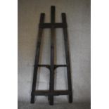 A large black painted wooden easel. H.193 x 73cm (Property of the late Jacqueline Morreau 1929-2016)