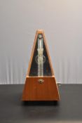A vintage hand winding Metronome 'Made in the German Democratic Republic'. H.24cm