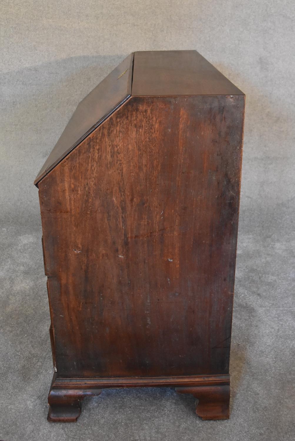 A Georgian mahogany bureau with fall front revealing fitted interior above four long drawers on - Image 5 of 5