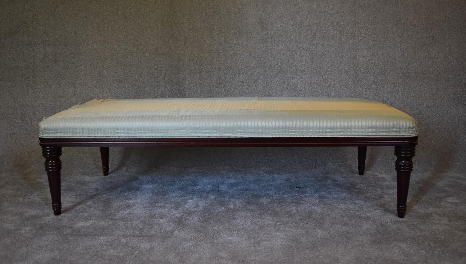 A mahogany framed day bed by George Smith upholstered in a silk fabric. (some wear). H.47 x 168 x