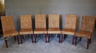 A set of six rattan high back dining chairs. H.96 x 46cm