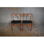 A pair of mid 20th century teak dining chairs. H. 80 x 49cm