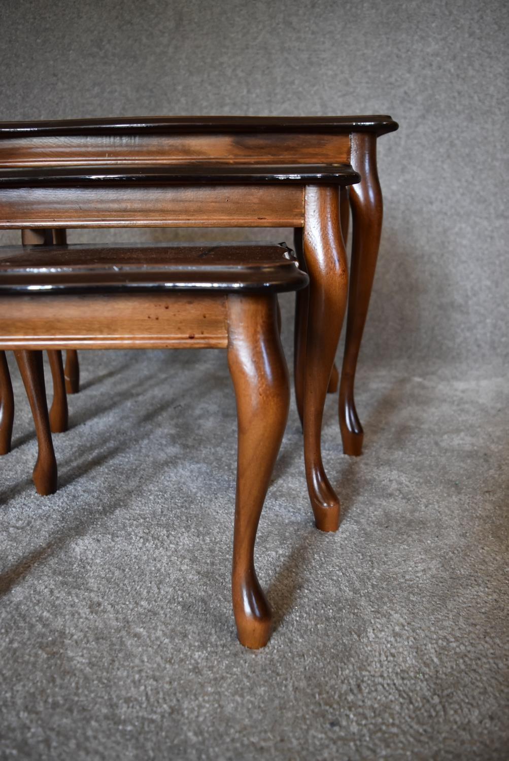 A nest of three graduating burr walnut occasional tables on cabriole supports. Largest - H.47 x 60cm - Image 2 of 7