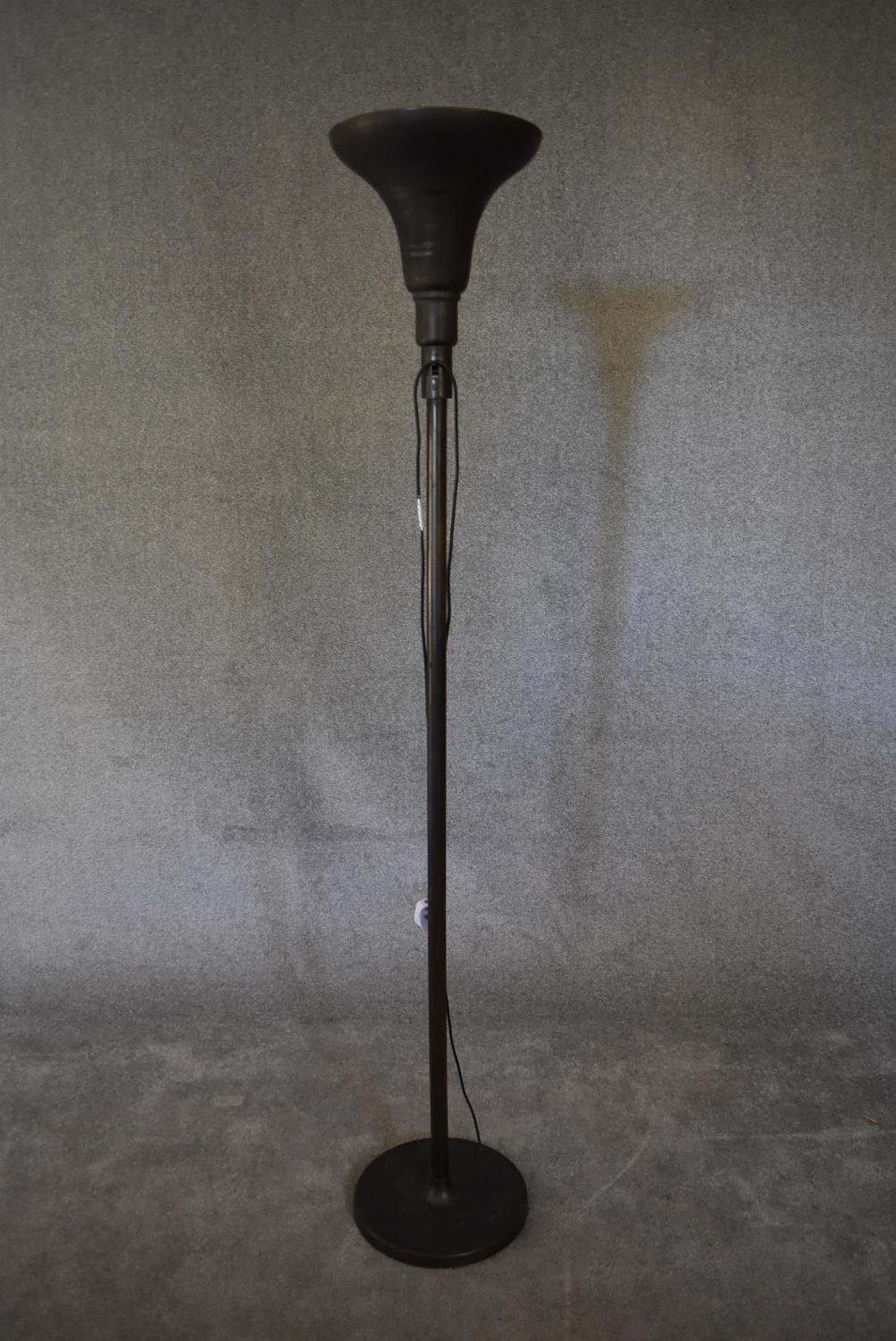 A mid 20th century black metal standing uplighter. H.173 x 30cm