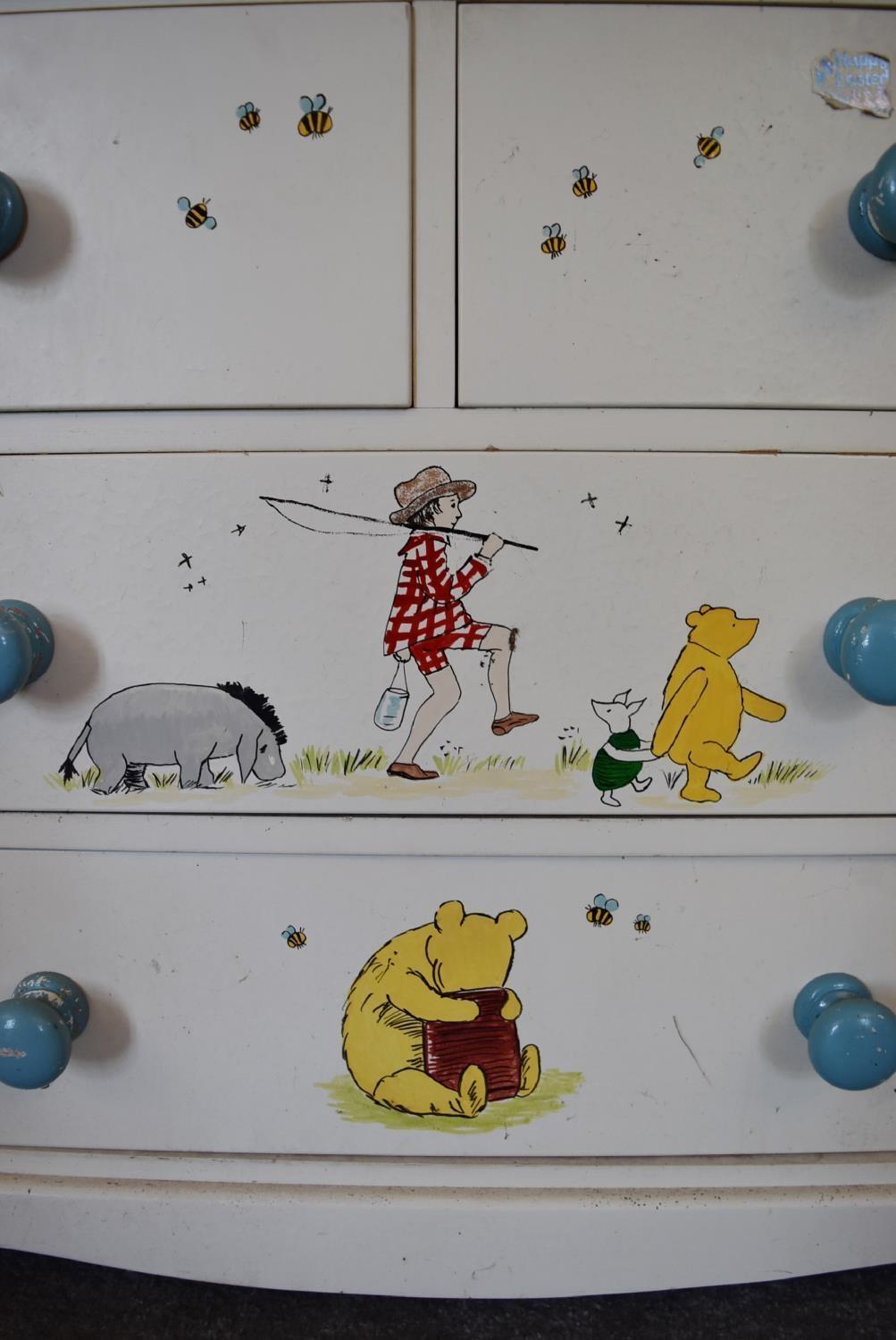 A pair of white painted pine chest of drawers with two short over two long drawers. Decorated with - Image 3 of 12