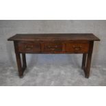 An antique country oak sideboard fitted three frieze drawers on square supports. H.76 x 130 x 43cm