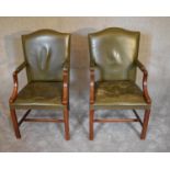 A pair of mahogany framed Gainsborough style armchairs in green leather upholstery. H.104 x 60cm