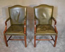 A pair of mahogany framed Gainsborough style armchairs in green leather upholstery. H.104 x 60cm