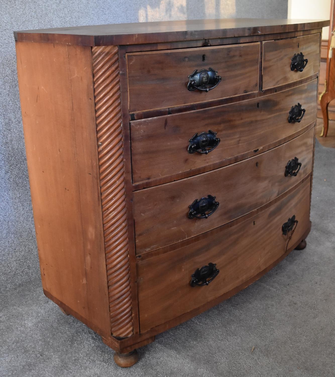 An Victorian mahogany bowfronted chest of two short over three long drawers flanked by spiral - Image 2 of 4