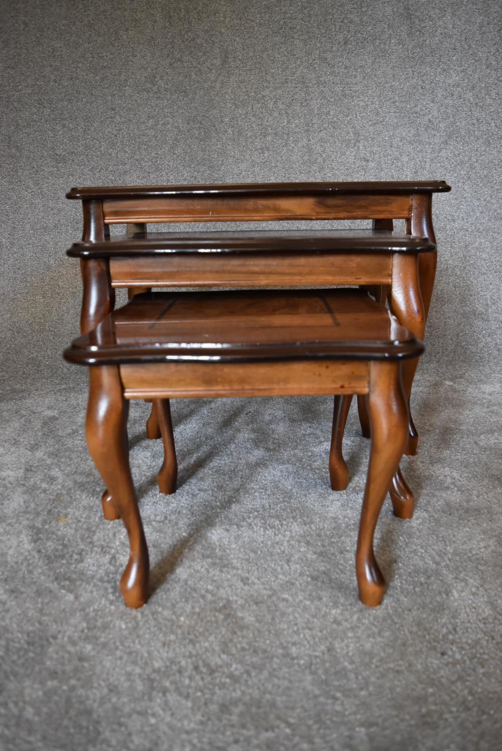 A nest of three graduating burr walnut occasional tables on cabriole supports. Largest - H.47 x 60cm - Image 3 of 7