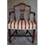 A Georgian mahogany Hepplewhite style open armchair. H.90 x 60cm