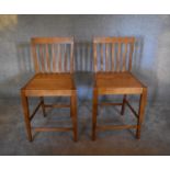 A pair of teak high stools. H. 100 x 50cm