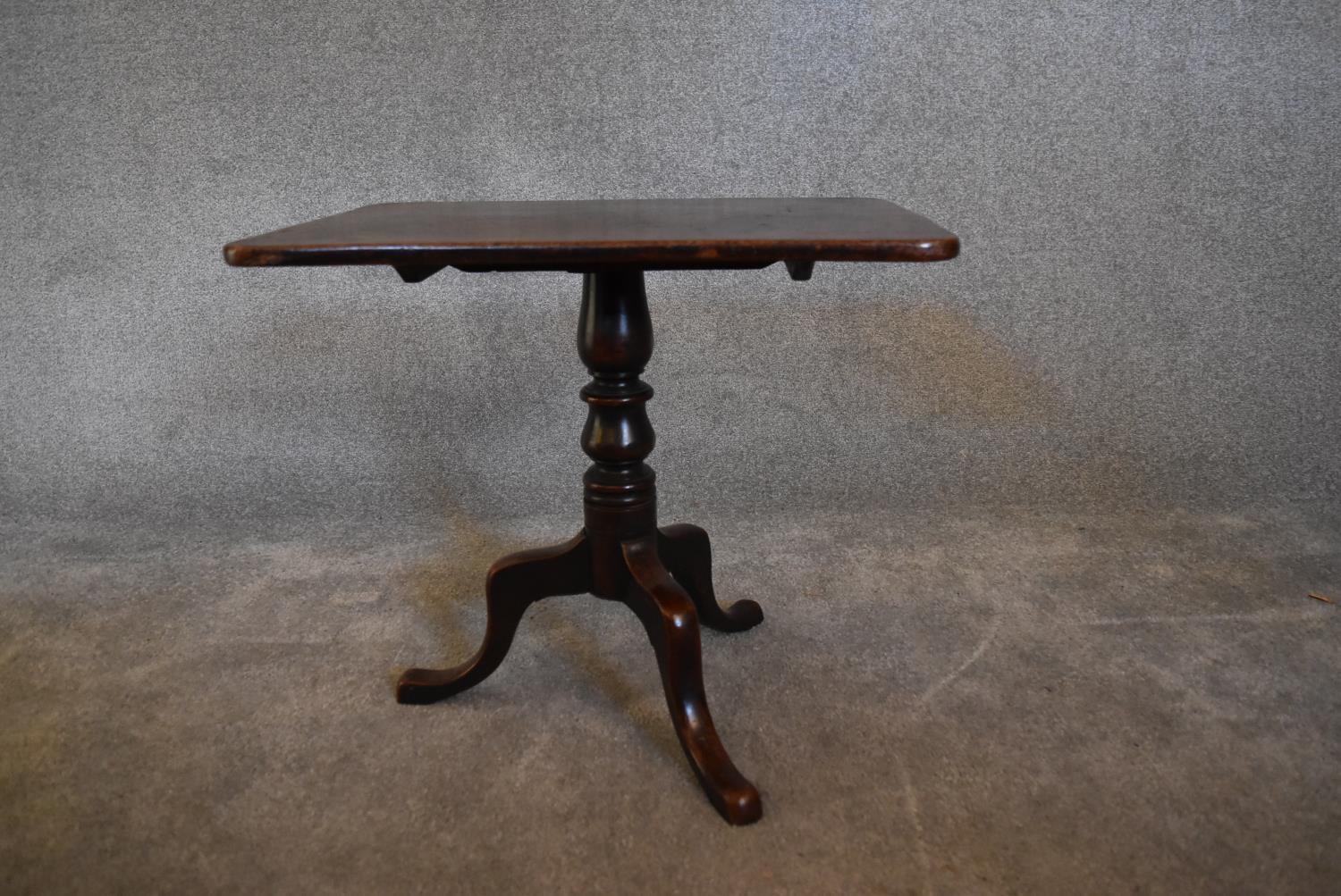 A 19th century mahogany tea table on tripod base with cabriole supports. 52 x 59cm