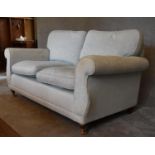 A two seater Laura Ashley sofa, upholstered in duck egg blue fabric. 77 x 160 x 80cm