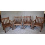 A set of four teak garden armchairs. H.87 x 60cm