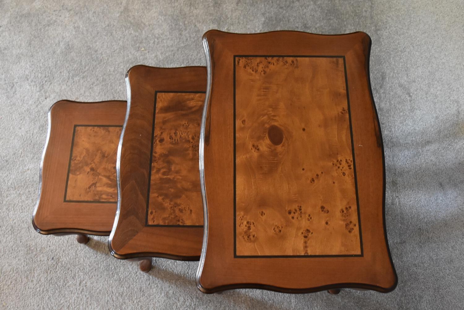 A nest of three graduating burr walnut occasional tables on cabriole supports. Largest - H.47 x 60cm - Image 4 of 7