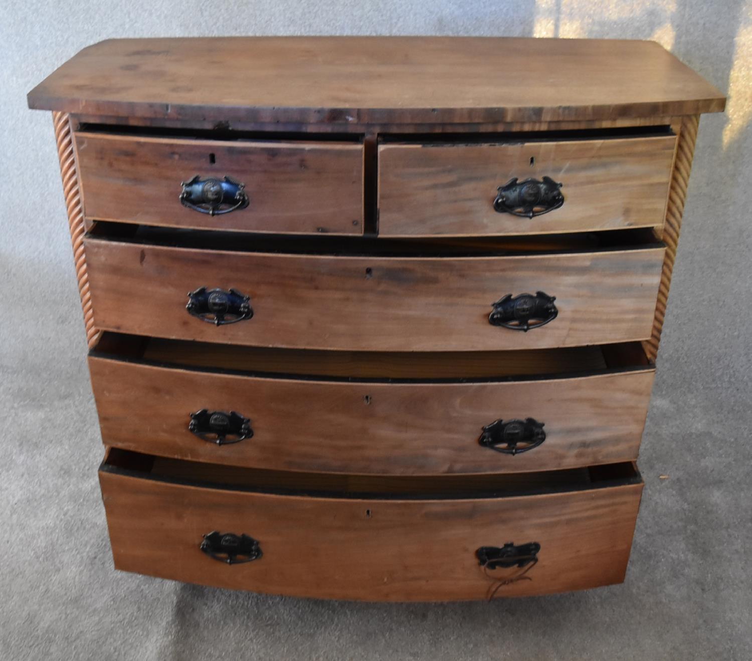 An Victorian mahogany bowfronted chest of two short over three long drawers flanked by spiral - Image 4 of 4