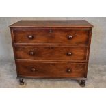 An early 19th century mahogany chest of three long drawers on turned supports. H. 97 x 110cm