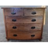 An Victorian mahogany bowfronted chest of two short over three long drawers flanked by spiral