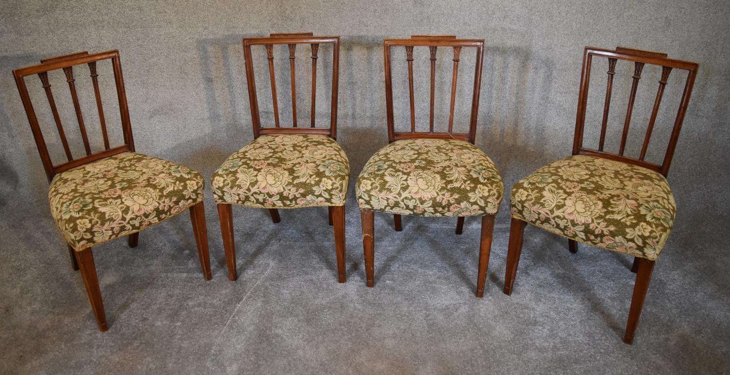 A set of four late 19th century Georgian style dining chairs with stuffover floral seats. H 89 x