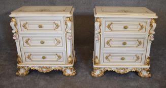 A pair of cream and gilt Rococo style bedside chests fitted three drawers on scrolling bracket feet.