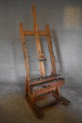 An adjustable and articulated beech framed professional artist's easel. H. 193 x 74cm (Property of