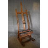 An adjustable and articulated beech framed professional artist's easel. H. 193 x 74cm (Property of