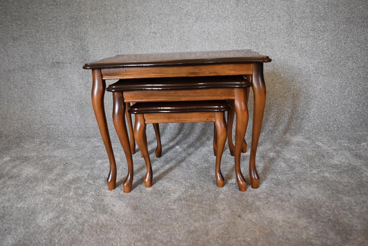 A nest of three graduating burr walnut occasional tables on cabriole supports. Largest - H.47 x 60cm - Image 7 of 7