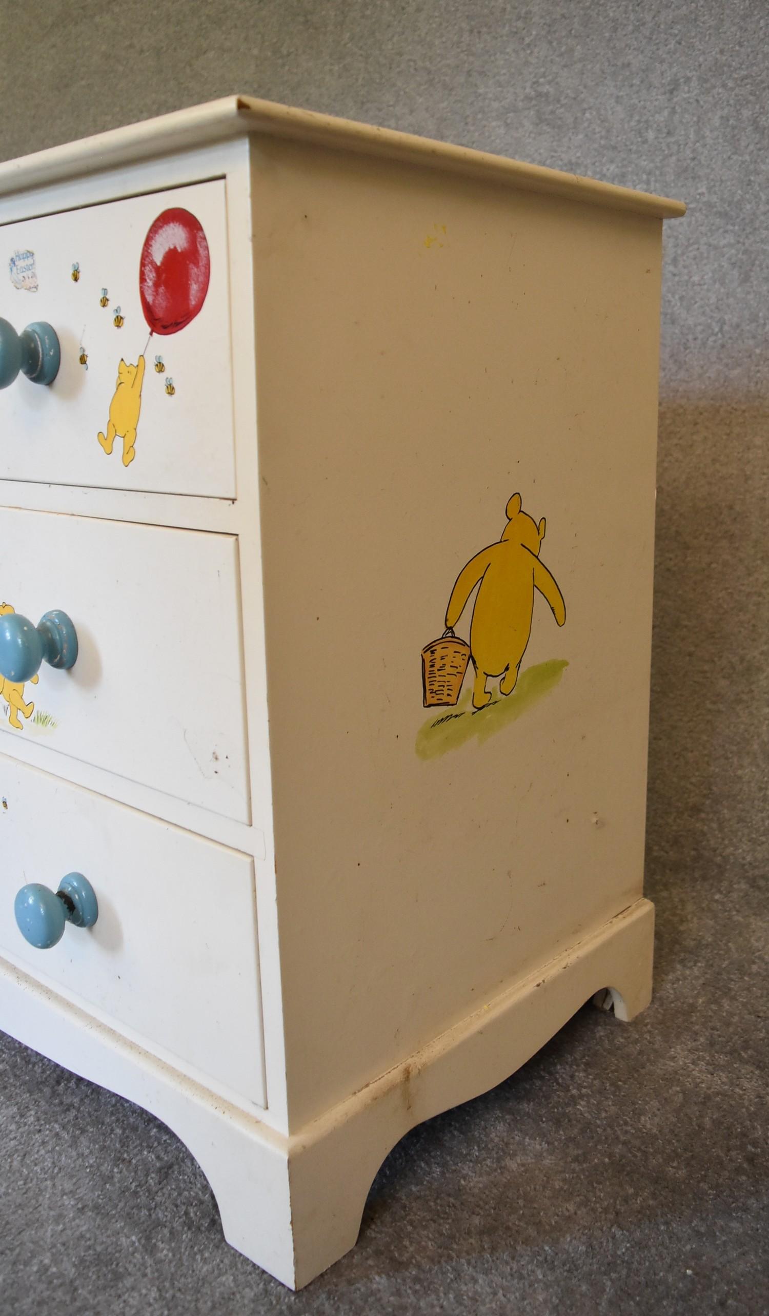 A pair of white painted pine chest of drawers with two short over two long drawers. Decorated with - Image 7 of 12