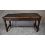 An antique oak farmhouse refectory table with extension leaf to one end and single drawer to the